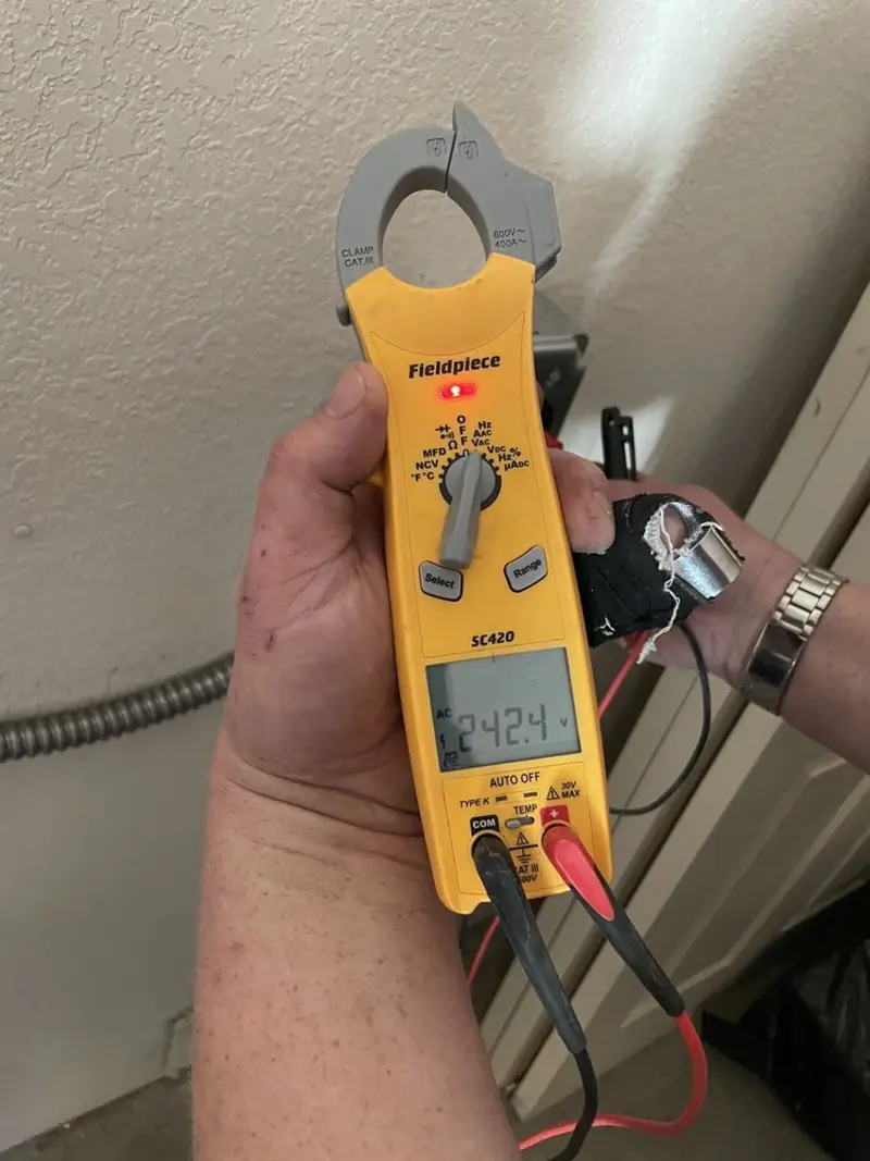 Voltage testing with clamp meter during Electrical Installation Services in Desert View Highlands